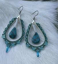 Load image into Gallery viewer, Turquoise teardrop center w/dentalium, 1 mm faceted blue tone stones, Charlotte cut beads in size 11 and 15, lt turquoise 4mm Swarovski crystals, and lt blue daggers. On hypoallergenic hooks.