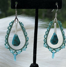 Load image into Gallery viewer, Turquoise teardrop center w/dentalium, 1 mm faceted blue tone stones, Charlotte cut beads in size 11 and 15, lt turquoise 4mm Swarovski crystals, and lt blue daggers. On hypoallergenic hooks.