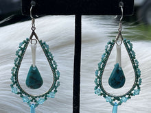 Load image into Gallery viewer, Turquoise teardrop center w/dentalium, 1 mm faceted blue tone stones, Charlotte cut beads in size 11 and 15, lt turquoise 4mm Swarovski crystals, and lt blue daggers. On hypoallergenic hooks.