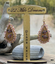 Load image into Gallery viewer, Teardrop shaped earrings with 2.5 mm tourmaline stone flowers and edging, size 11 24k gold seed bead centers and edging, 24k gold plated light rose crystal marquise chain. On moose skin w/light shiny pink backing. 24k gold plated hooks.